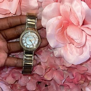 Micheal Kors gold watch in box.
